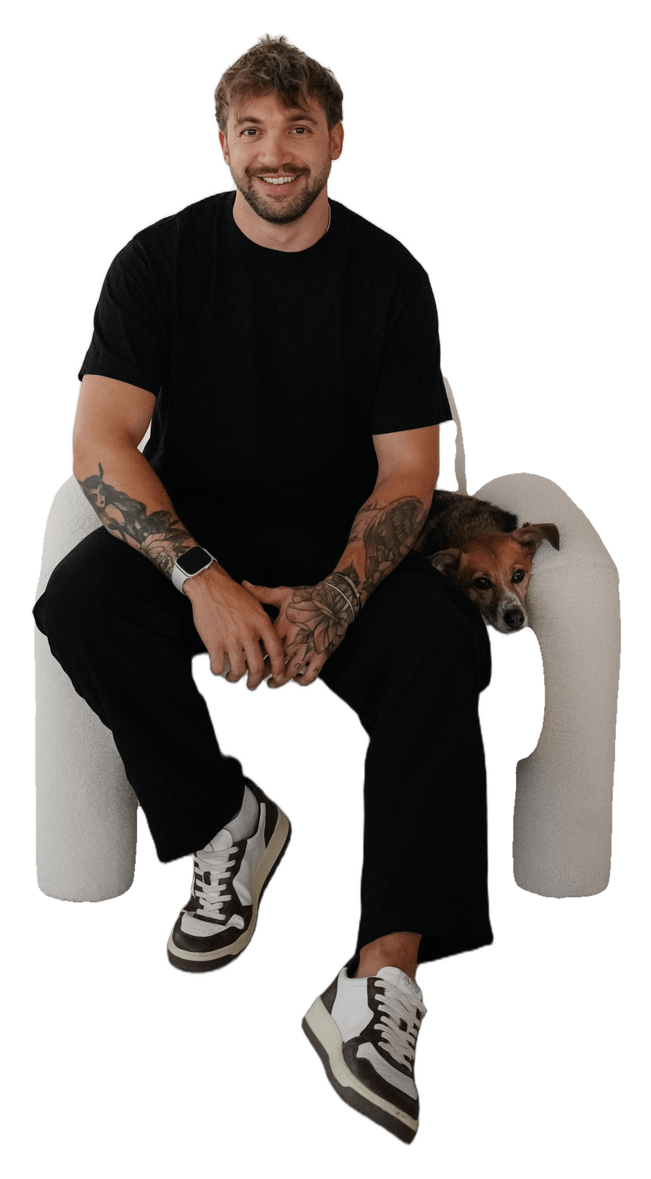 Marvin Lehmann sitting on a chair, his dog beside him